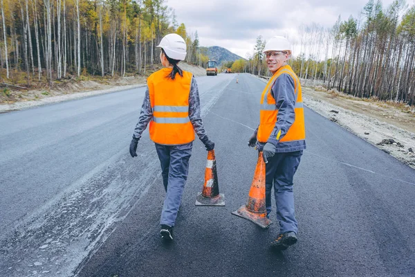 cone worker asphalting