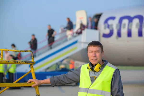 airport worker arrival landing runway outside male