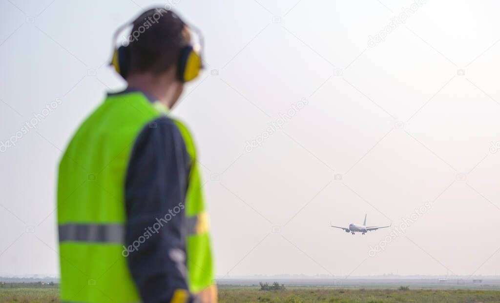 airport worker arrival landing runway outside male