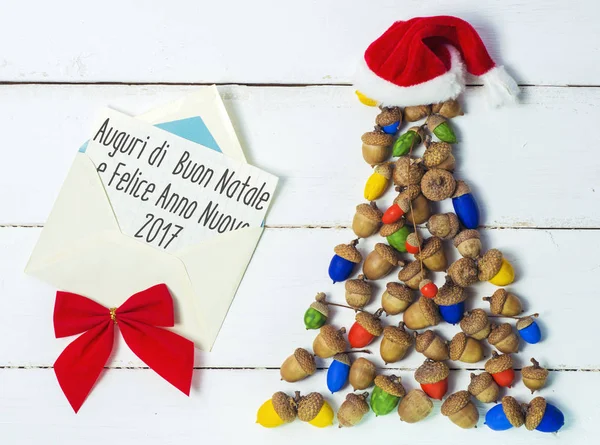 Веселого Різдва і щасливого нового року в італійську мову. ручної роботи ялинкові 2017 картки — стокове фото