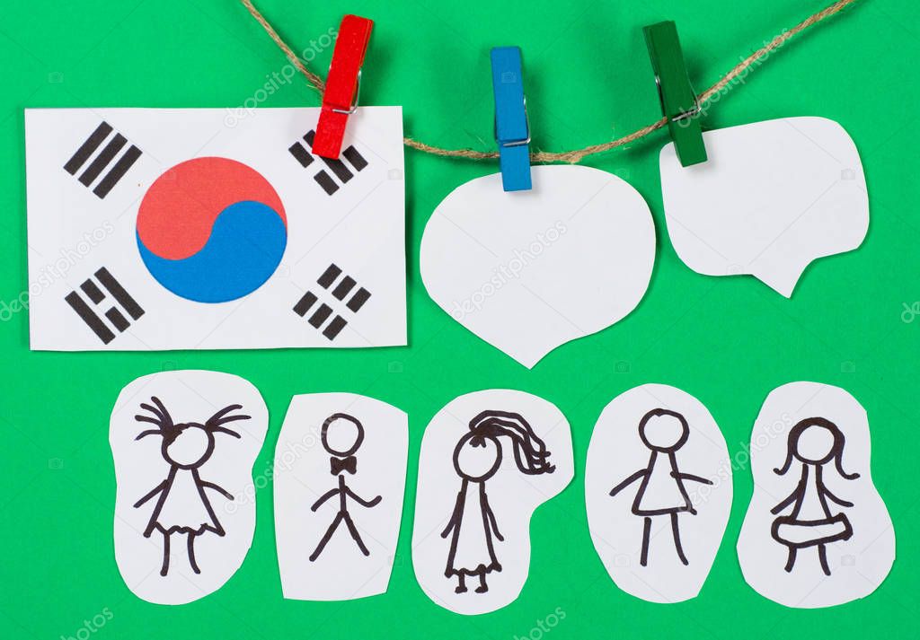 Paper people with  dialog speech bubbles and South Korea flag hanging pegs. Social networking concept. March 1st Movement celebrated march 1