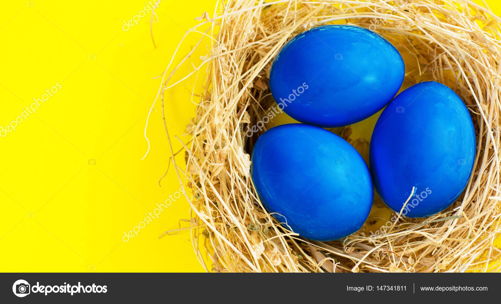 Download Happy Easter Card Space For Text Blue And Yellow Easter Eggs In Nest On Rustic Wooden Background Selective Focus Image Stock Photo C Romatitov626 Gmail Com 147341811 PSD Mockup Templates