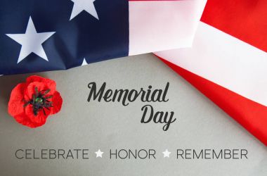 Text Memorial Day on American flag And a poppy flower background clipart