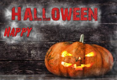 Ahşap zemin üzerine sis hayaletlere çevrili spooky Halloween balkabağı kafa jack fener