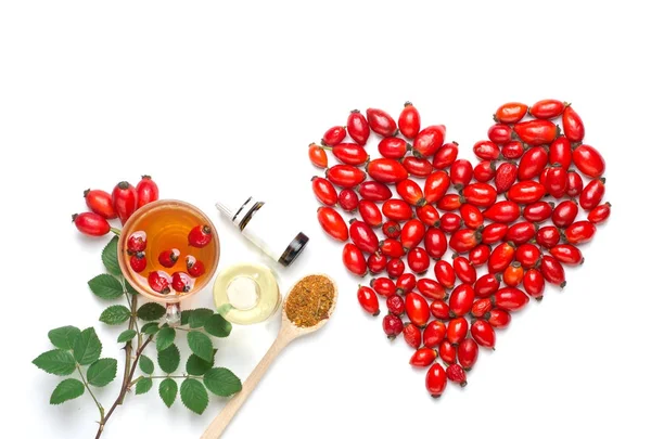 Şifalı bitkiler ve otlar kompozisyon: köpek rose, grup şube kuşburnu, Rosa canina kalça, uçucu yağ türleri. Grup, Kuşburnu çayı 