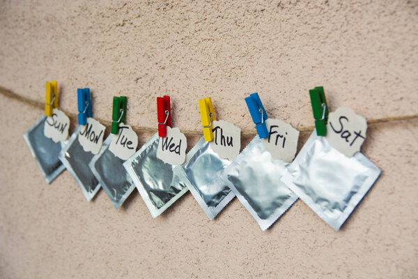 condoms on colorful clothespins