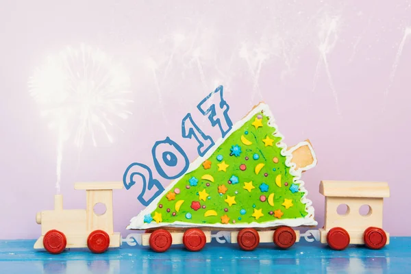 Christmas tree on toy train. holiday Gingerbread Cookies . Merry Christmas and Happy New Year card celebration card
