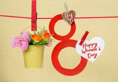 Mutlu kadın gün kartı 8 Mart kutlamak, lolipop şekli sekiz rakamı 8, Not metin için çiçek renkli kovalar 
