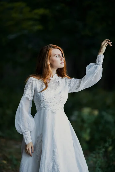 Young sexy redhead woman in white bridal vintage dress — Stock Photo, Image