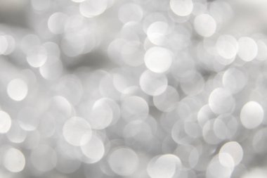 Bokeh ve pırıltılar Gümüş arka plan bulanık.