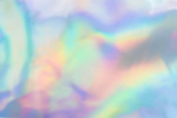 Абстрактный голографический фиолетовый розовый фон. Жидкая неоновая радужная фольга в стиле единорога. Мраморная радужная футуристическая текстура. Трендовый стиль 90-х.