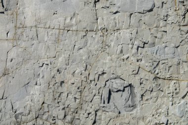 Küçük taşlı beton gri kaya dokusu duvarı. Dokusal doğal arkaplan. Kopyalama alanı.