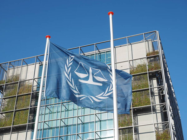 The Hague, Netherlands - November 3, 2017: The flag and the main building of International Criminal Court.