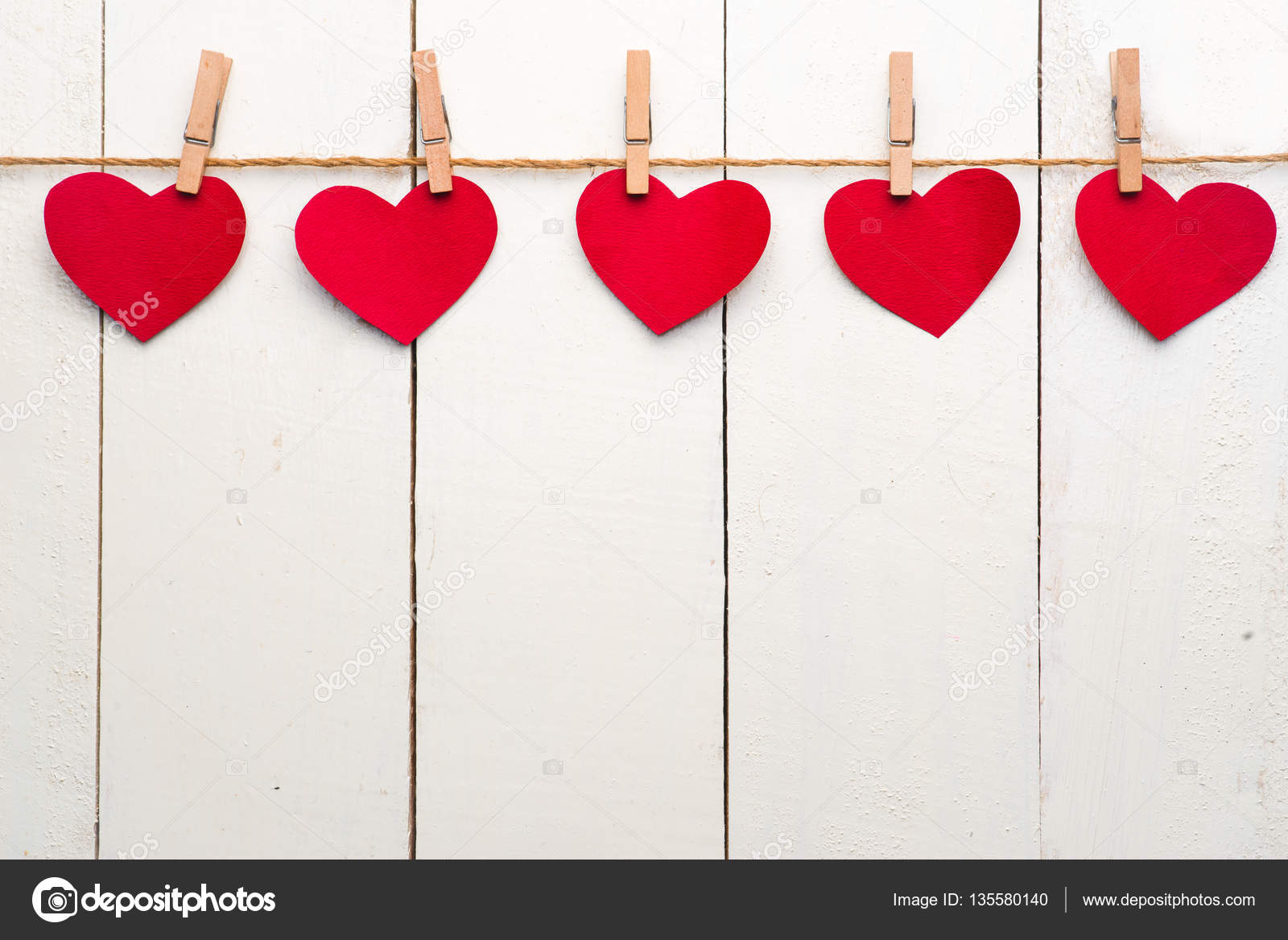 Red hearts hanging on clothesline — Stock Photo © makidotvn #135580140
