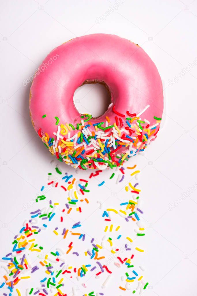 Donuts with icing on faded pink