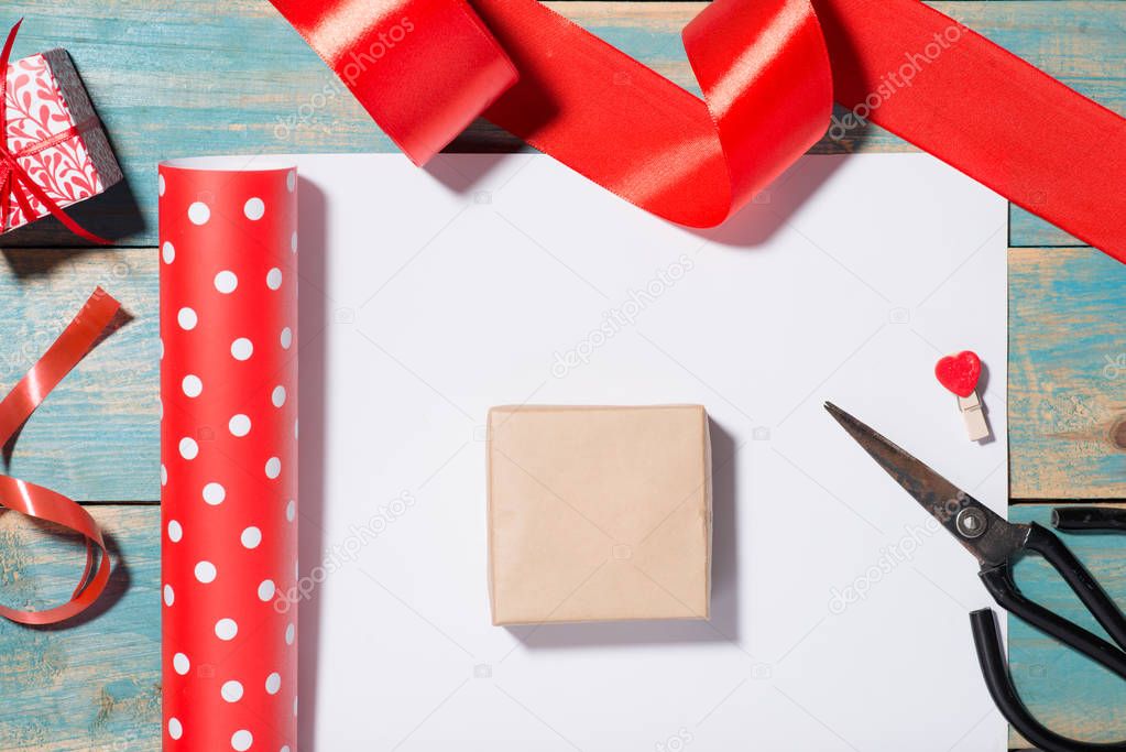 Valentine's Day greeting card over wooden background. Top view with copy space