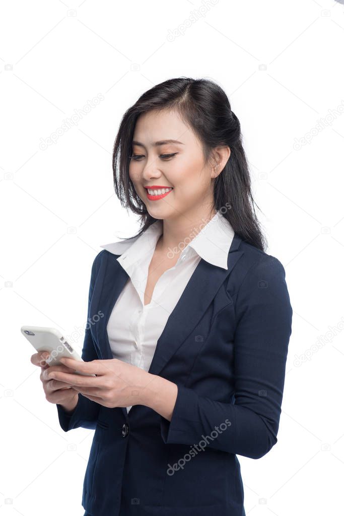 Asian businesswoman using smartphone to send message.