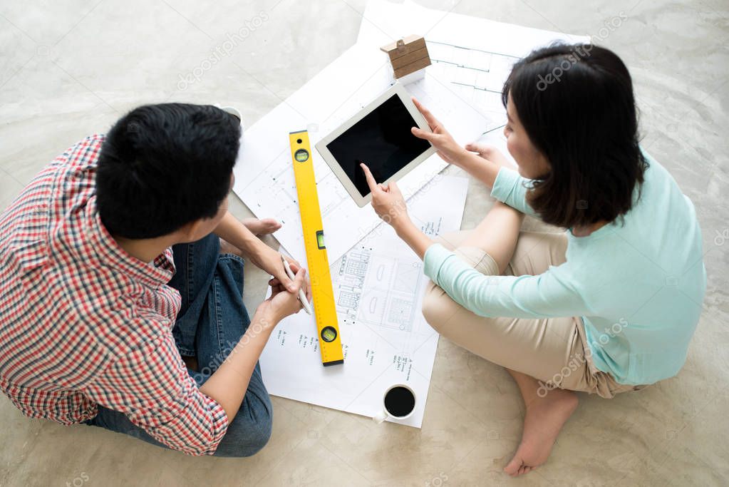 couple looking at house plans