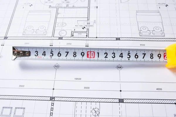 Architectural plans and tape measure — Stock Photo, Image