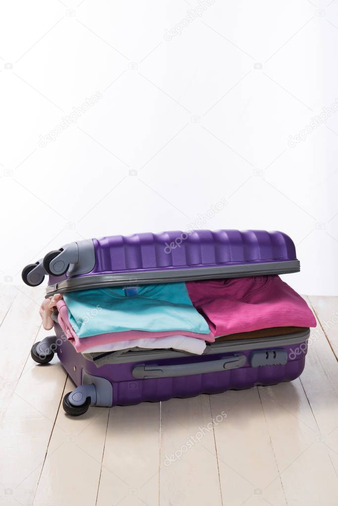 Open traveler's bag with clothing,