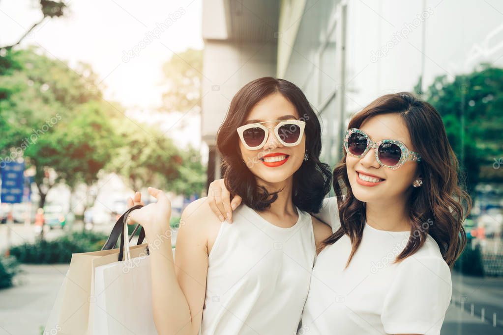 two girls with shopping bags