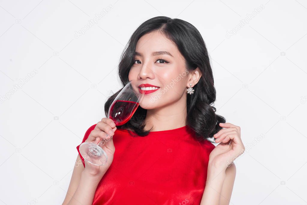 woman holding wine glass.