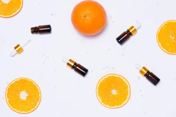 Recipientes cosméticos con rodajas de naranja —  Fotos de Stock