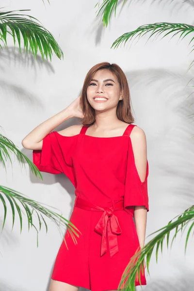 Smiling woman in red dress — Stock Photo, Image