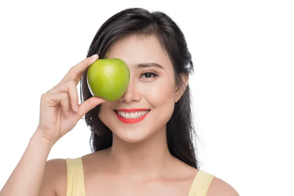 Pretty young asian woman holding fresh apple isolated on white background. — Stock Photo, Image