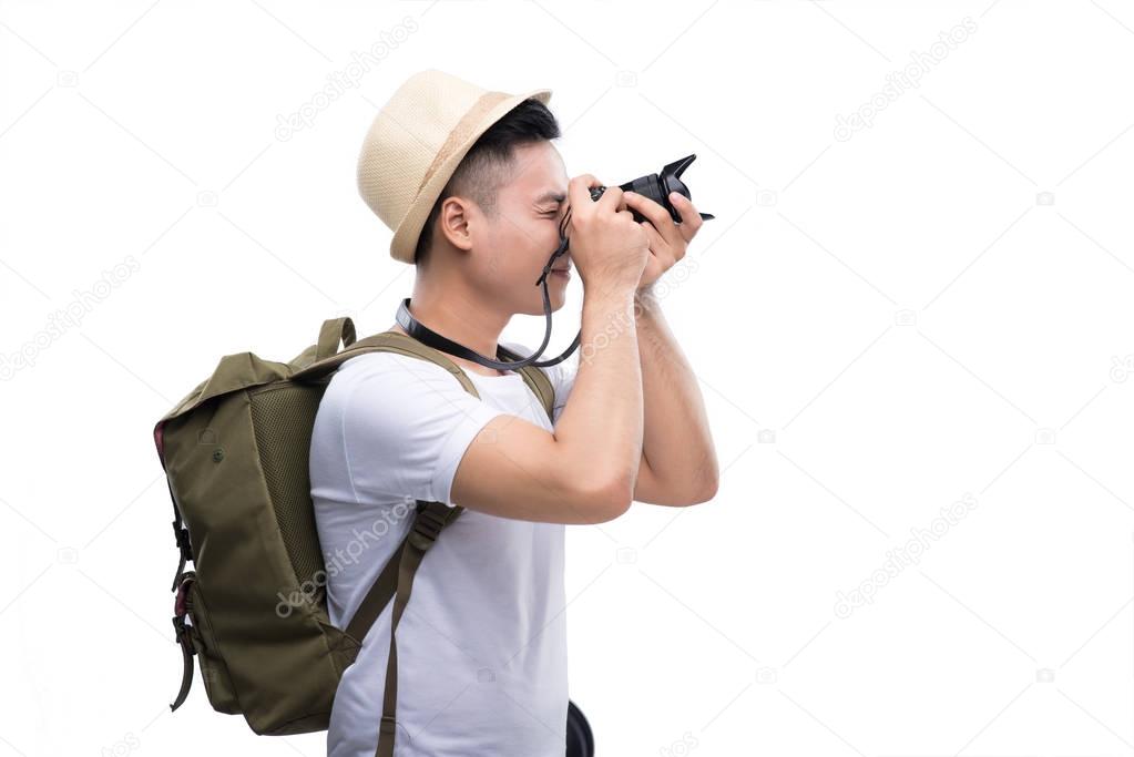 Young traveller taking picture.