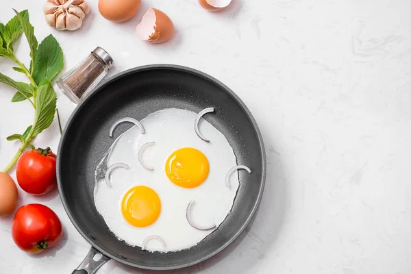 Fried eggs in pan