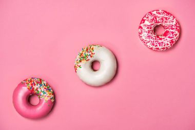Three donuts with icing  clipart