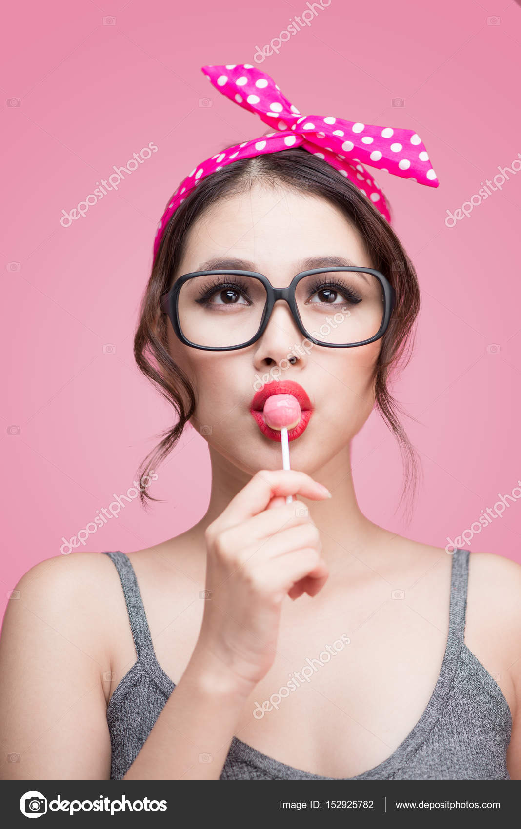 Woman eating lollipop Stock Photo by ©makidotvn 152925782