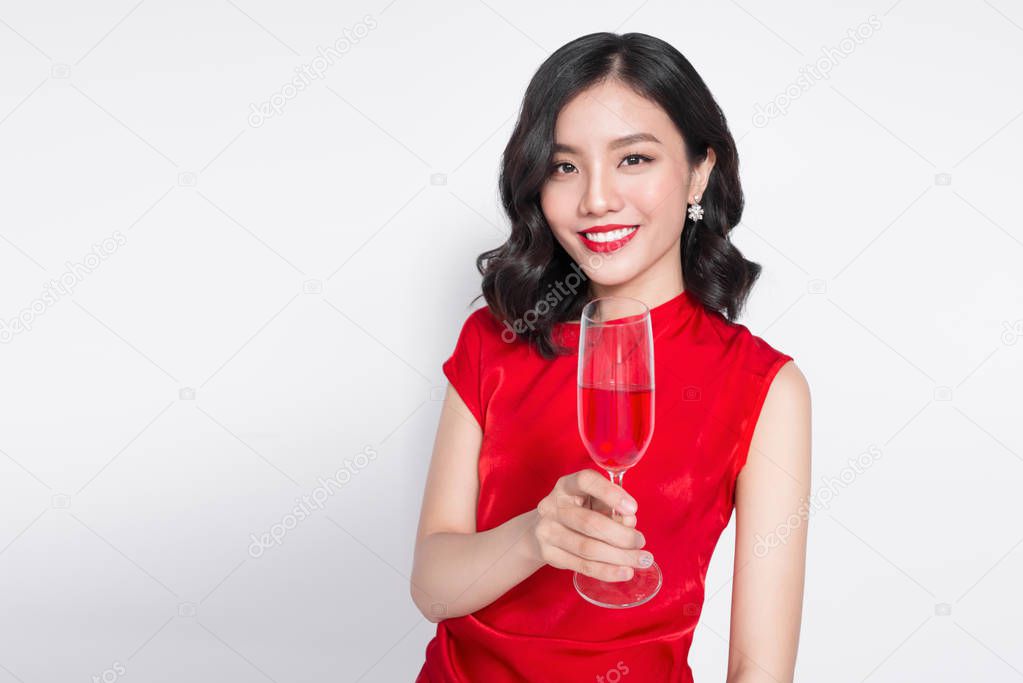 woman holding wine glass.