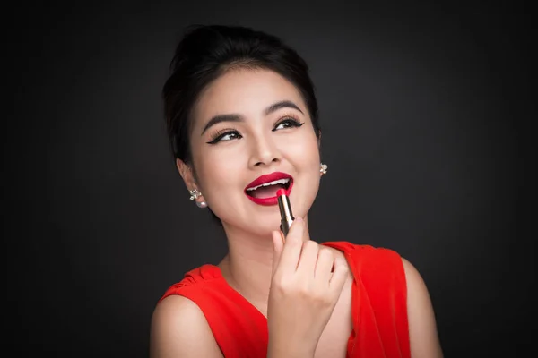 Woman applying red lipstick. — Stock Photo, Image