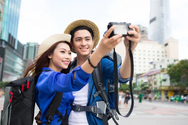 couple taking selfie with camera