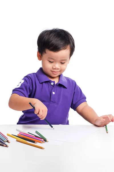 Liten pojke med färgglada pennor — Stockfoto