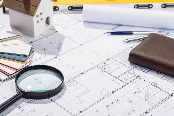 Open blueprints with supplies — Stock Photo, Image