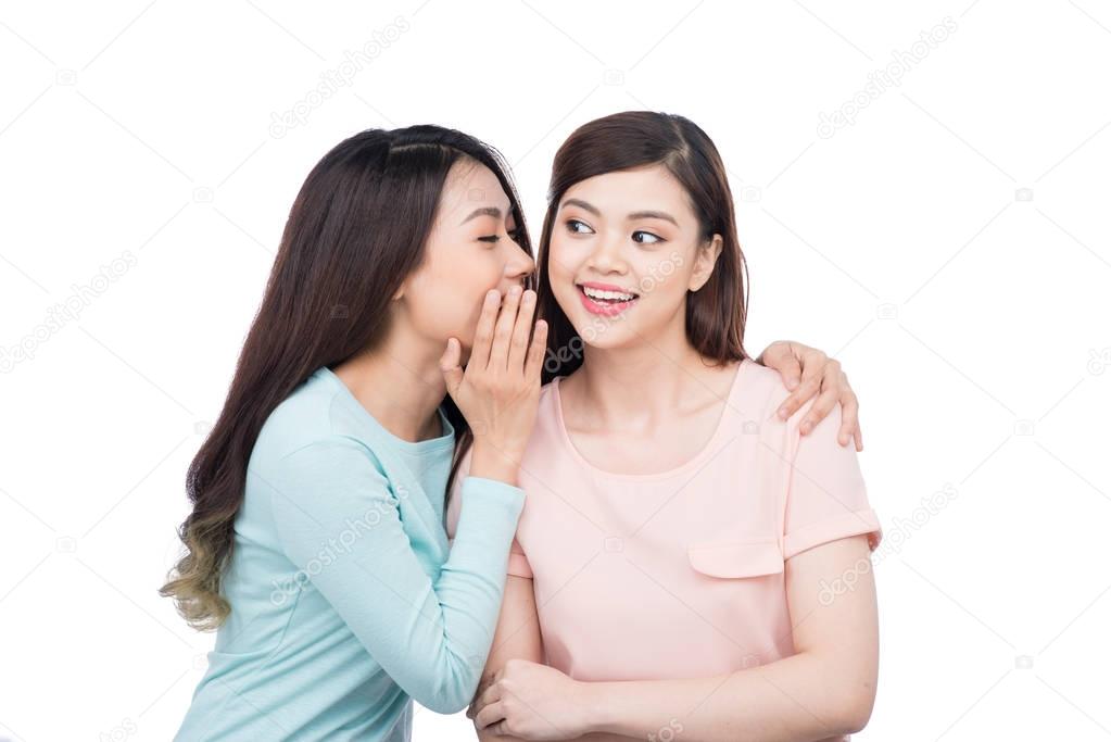 girls talking sharing secret 