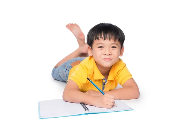 Schoolboy Escrita em caderno . — Fotografia de Stock