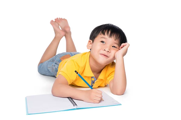 Schoolboy Escrita em caderno . — Fotografia de Stock