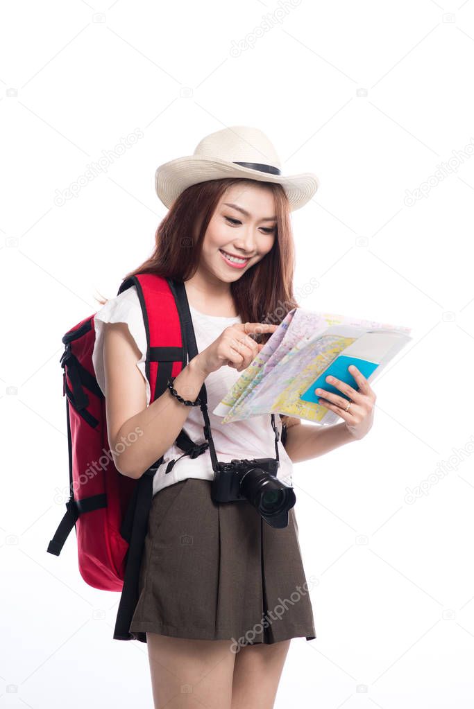 young girl with backpack, camera and map