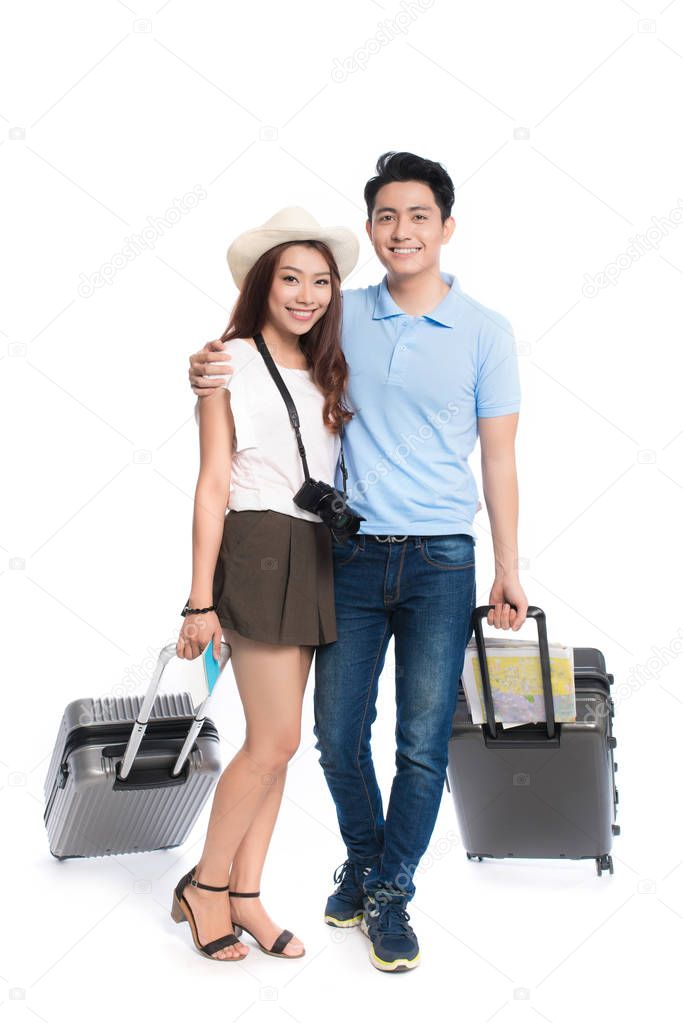 young couple with camera and map
