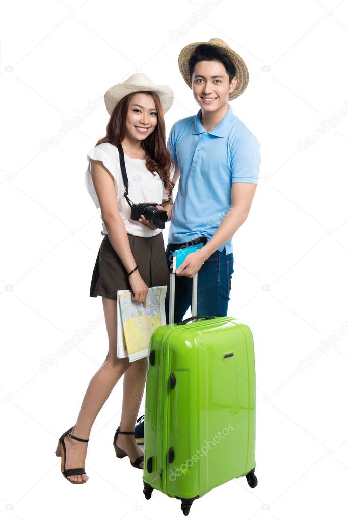 young couple with camera and map