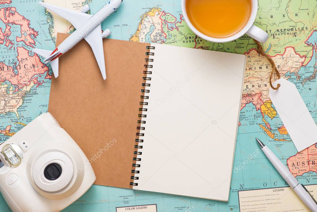 Travel. Trip. Vacation - Top view of airplane, camera, passport 