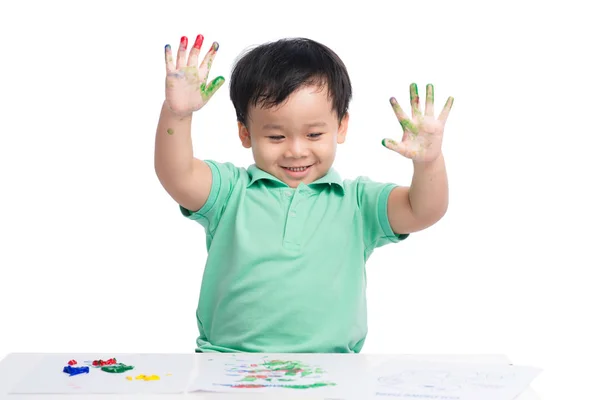 Niño jugando con acuarelas — Foto de Stock