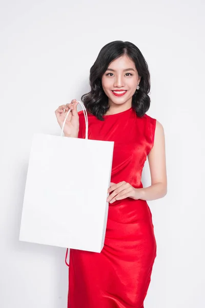 购物袋红色连衣裙的女人 — 图库照片