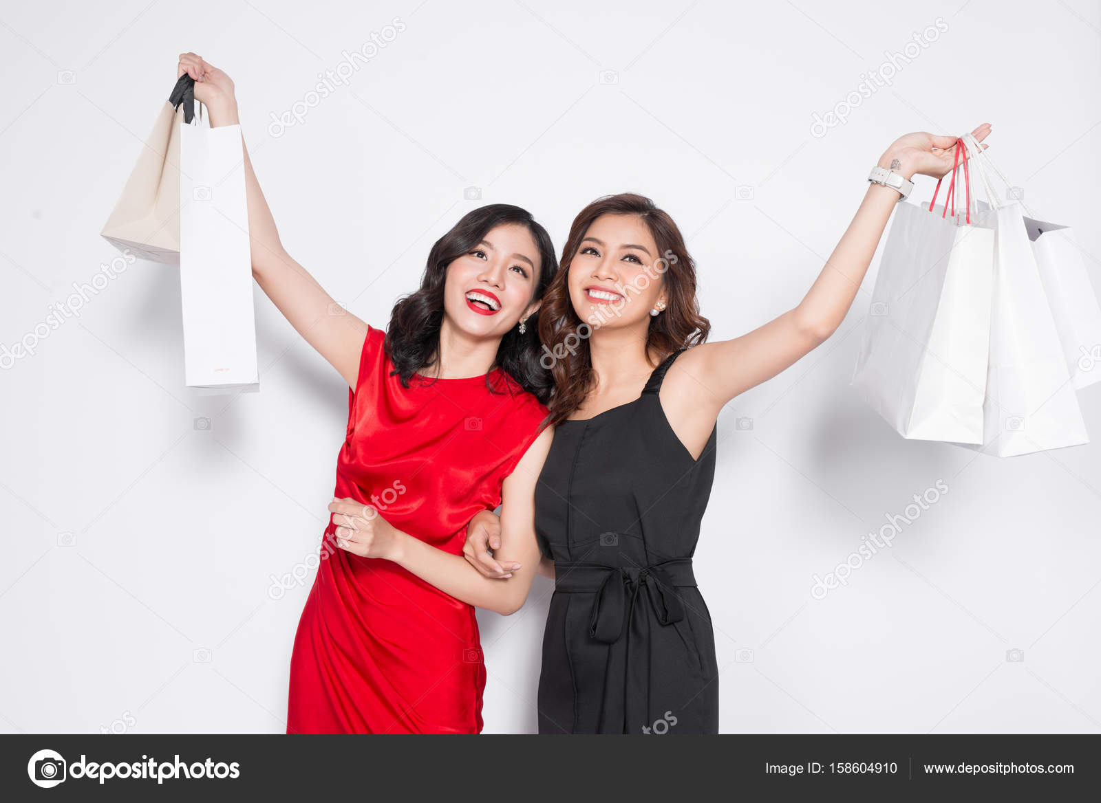 Two women in dresses Stock Photo by ©makidotvn 158604910