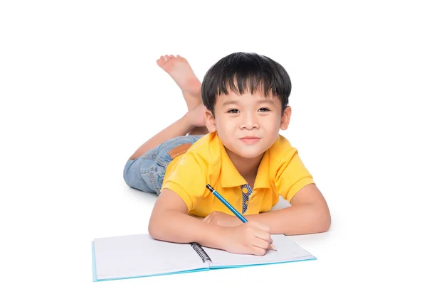 Schoolboy Escrita em caderno . — Fotografia de Stock