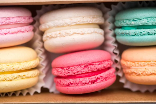 Sweet macarons. Different french cookies macaroons in a paper bo — Stock Photo, Image